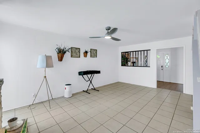 wooden floor in an empty room with a fireplace