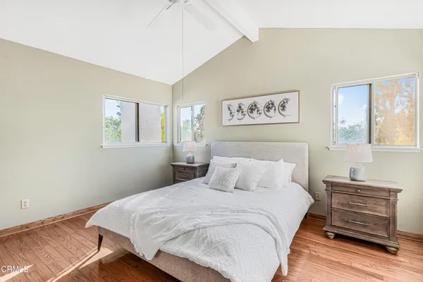 a bedroom with a bed and a night stand