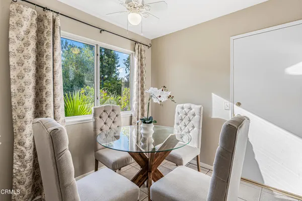 a view of a dining room with furniture window and outside view