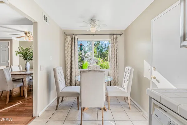 a view of a dining room with furniture window and outside view