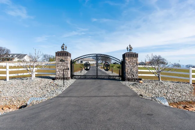 a view of a house with backyard porch and sitting area