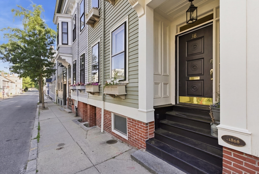 38 Bartlett Street Boston, MA 02129 - Photo 2 of 37 a view of a brick house with many windows