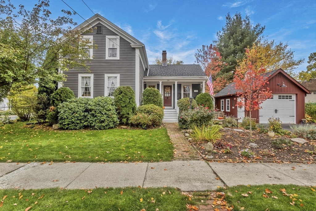 a front view of a house with garden