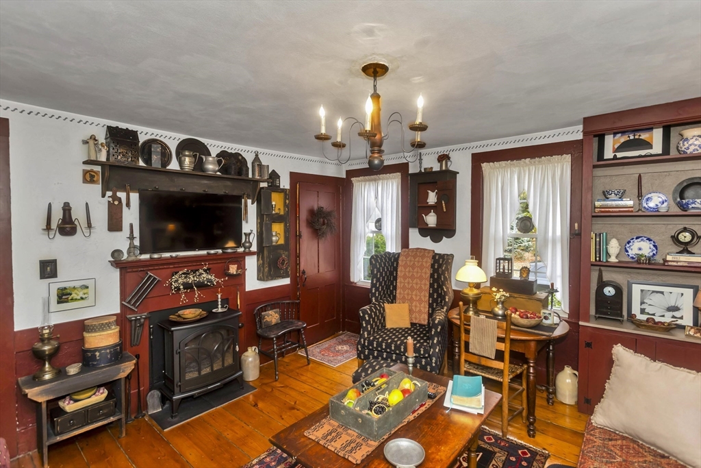 20 Auburn Street Chicopee, MA 01013 - Photo 21 of 36 a living room with furniture a flat screen tv and kitchen view