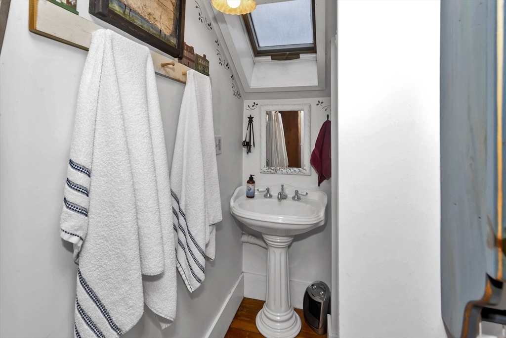 20 Auburn Street Chicopee, MA 01013 - Photo 26 of 36 a bathroom with a sink and mirror