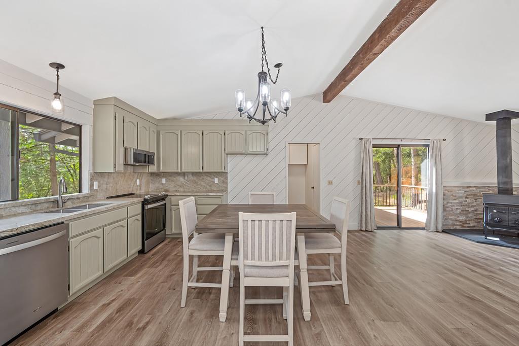 15358 Sky Pines Road Grass Valley, CA 95949 - Photo 19 of 37 Updated kitchen with Quartz counter tops, high end stainless steel appliances, new lighting fixtures. Luxury vinyl plank flooring throughout the home.