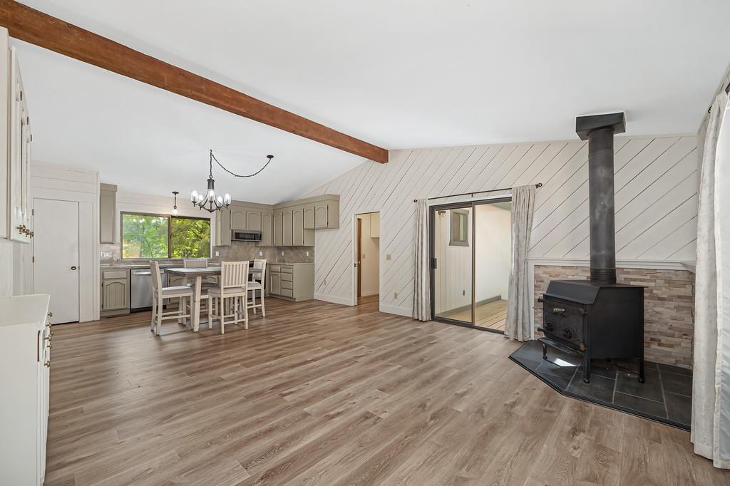 15358 Sky Pines Road Grass Valley, CA 95949 - Photo 22 of 37 Family room with wood stove open to the updated kitchen. Fresh paint throughout the home.