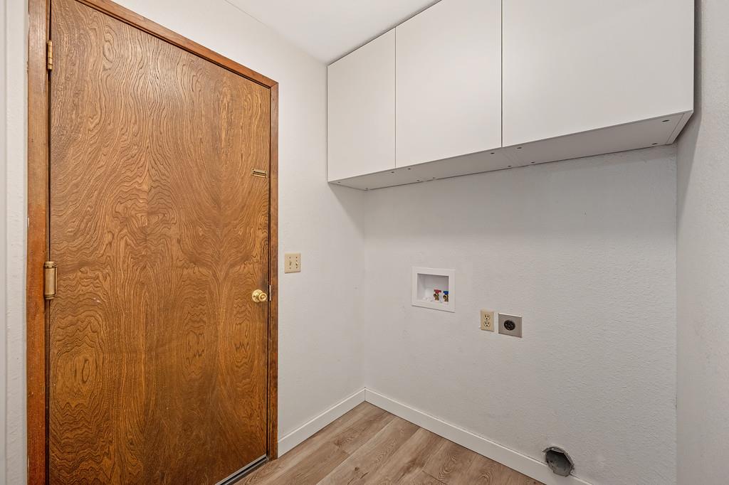 15358 Sky Pines Road Grass Valley, CA 95949 - Photo 24 of 37 Laundry room with hoop ups, cabinetry and 1/2 bath