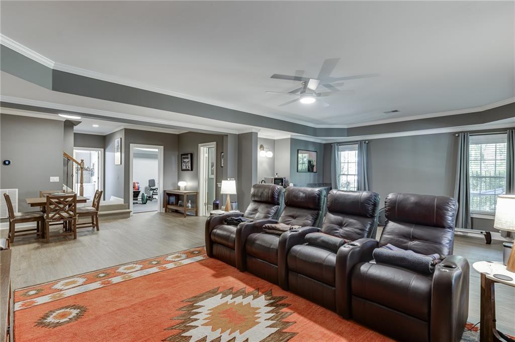 2758 Pathview Drive Dacula, GA 30019 - Photo 38 of 48 a living room with furniture and a chandelier