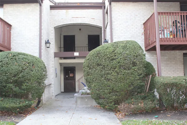a front view of a house with yard