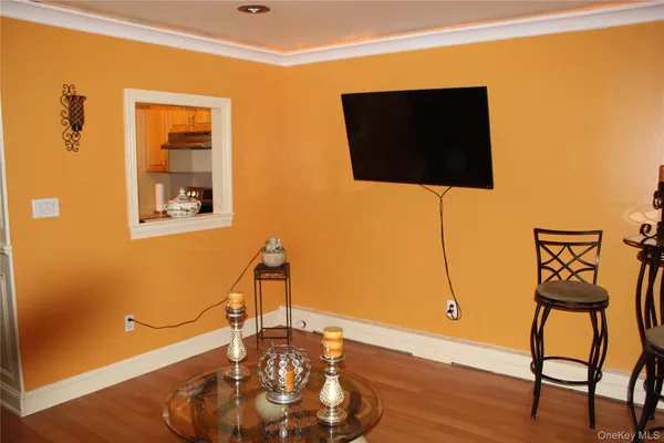 a living room with a flat screen tv and a table