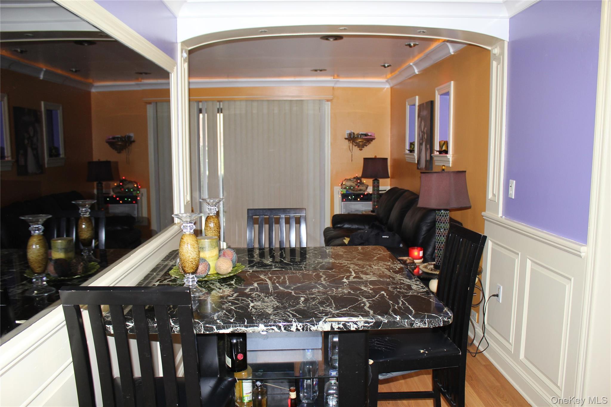 8 Secora Road, Unit J4 Monsey, NY 10952 - Photo 7 of 10 a room with lots of furniture and wooden floor