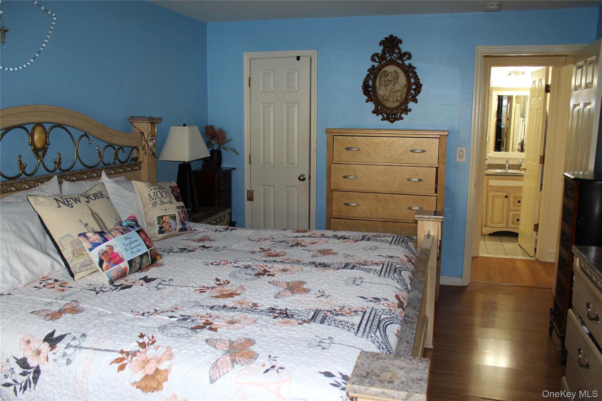 8 Secora Road, Unit J4 Monsey, NY 10952 - Photo 8 of 10 a bedroom with a bed and wooden floor