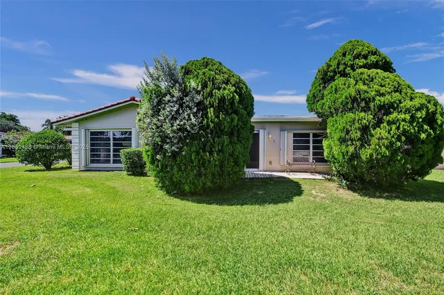 front view of a house with a yard