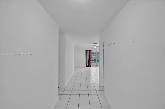 a view of empty room with fireplace