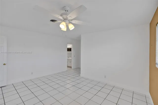 a view of an empty room and window