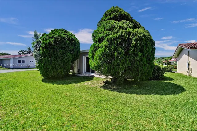 a view of a garden with a fountain