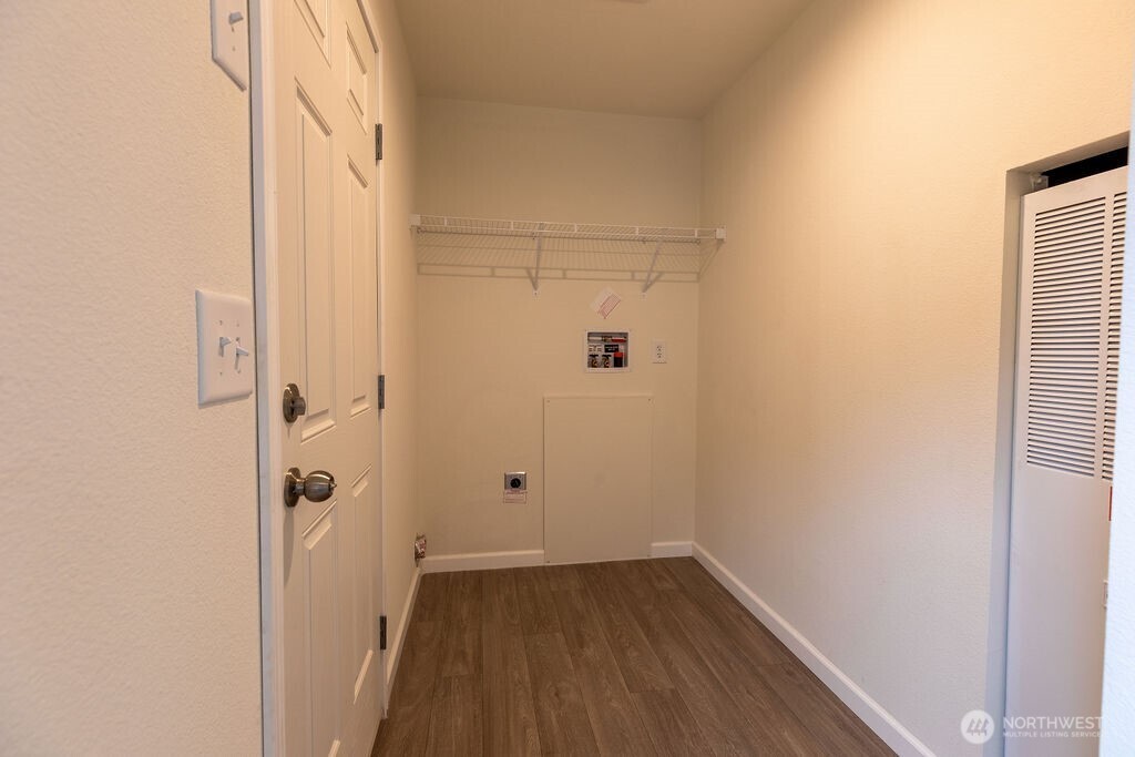 1450 Calawah Way Forks, WA 98331 - Photo 12 of 38 a view of a small space with wooden floor and a bathroom