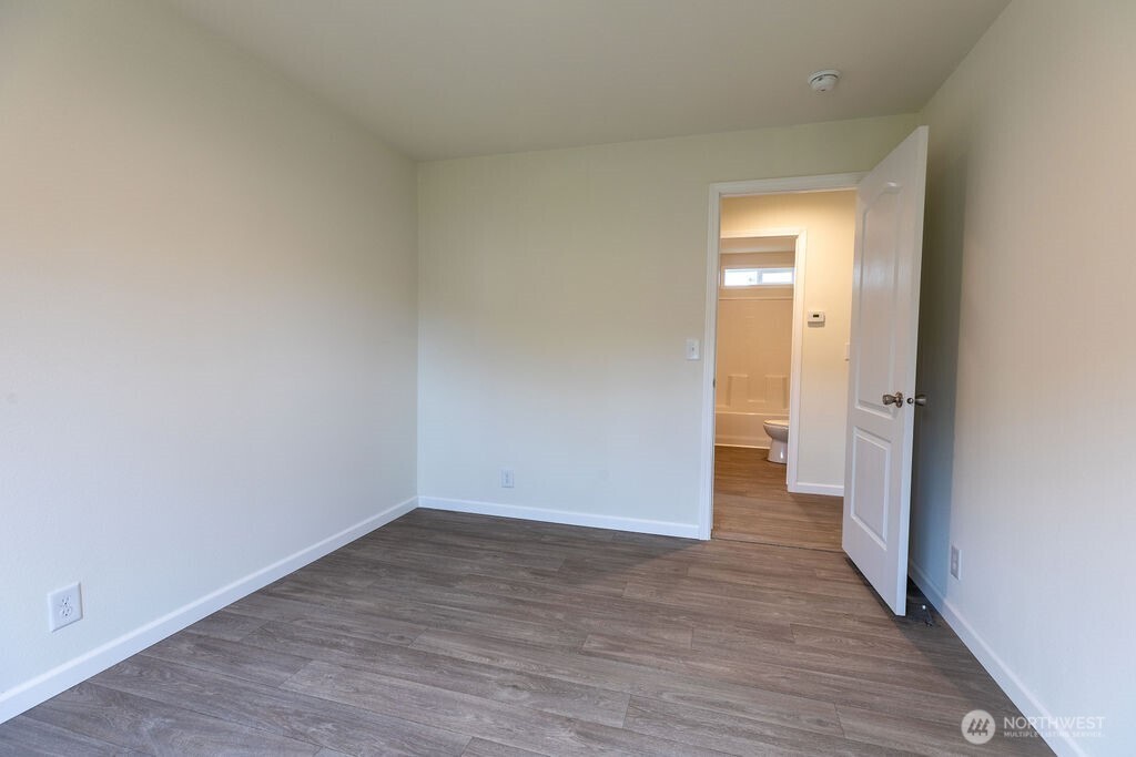 1450 Calawah Way Forks, WA 98331 - Photo 19 of 38 a view of a room with wooden floor