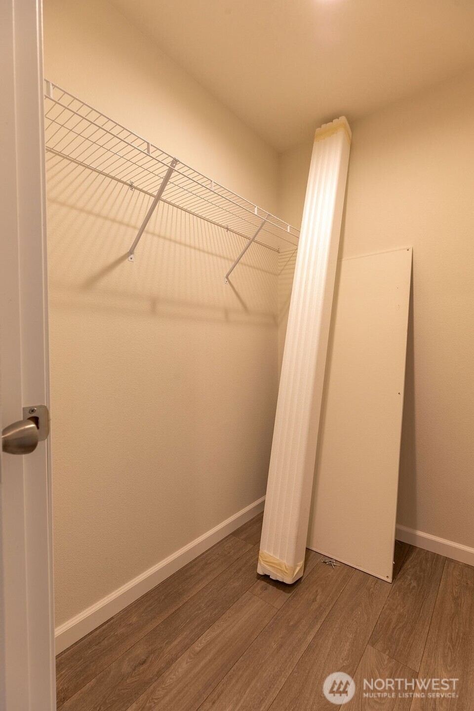 1450 Calawah Way Forks, WA 98331 - Photo 26 of 38 an empty room with wooden floor and cabinet