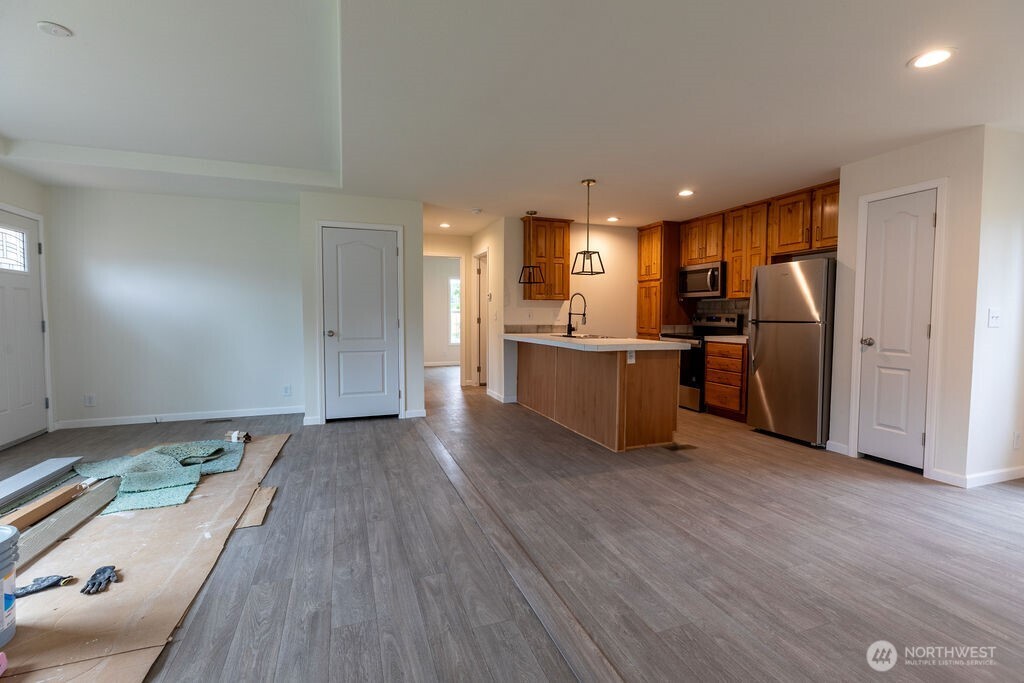 1450 Calawah Way Forks, WA 98331 - Photo 28 of 38 a view of a kitchen with a sink and stainless steel appliances