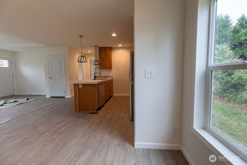 1450 Calawah Way Forks, WA 98331 - Photo 31 of 38 a room with furniture and wooden floor