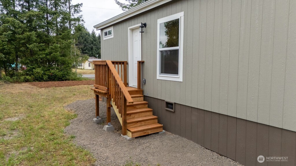 1450 Calawah Way Forks, WA 98331 - Photo 35 of 38 a view of a backyard with stairs and a ceiling fan