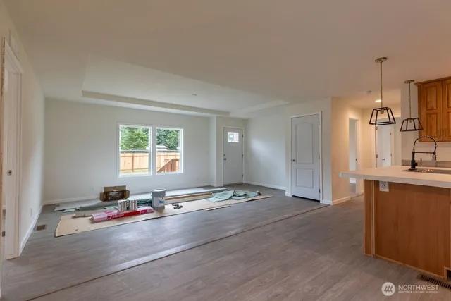 a view of a kitchen with a sink and a window