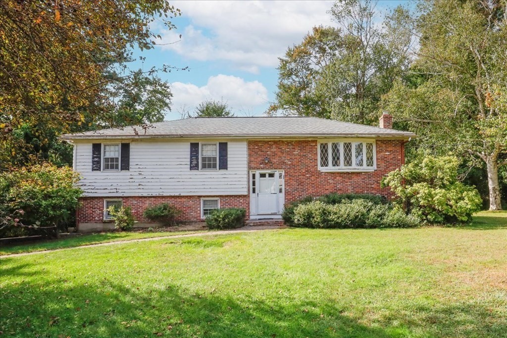 1 Donald Circle Andover, MA 01810 - Photo 1 of 42 a front view of a house with garden