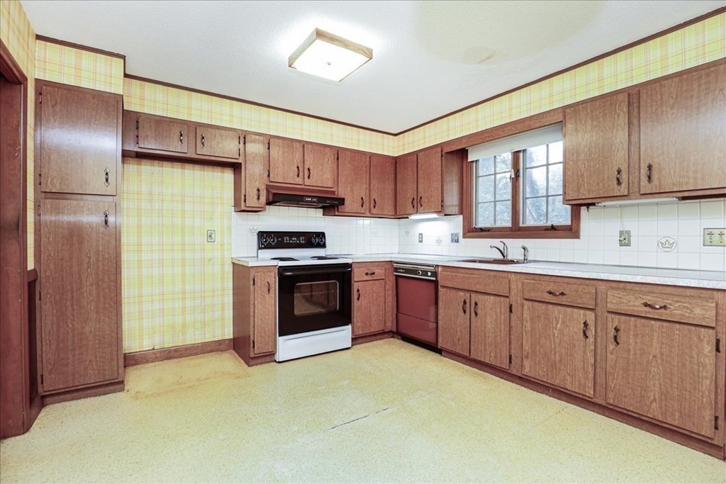 1 Donald Circle Andover, MA 01810 - Photo 11 of 42 a kitchen with stainless steel appliances granite countertop a stove a sink dishwasher a refrigerator and a microwave oven