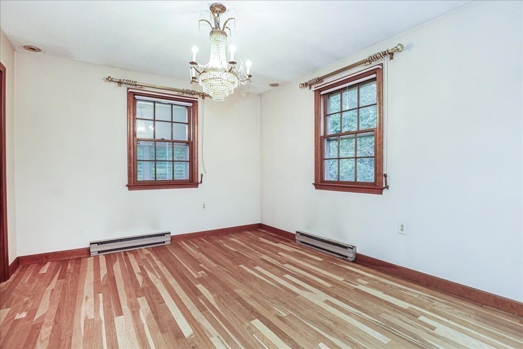 1 Donald Circle Andover, MA 01810 - Photo 14 of 42 a view of empty room with wooden floor and fan