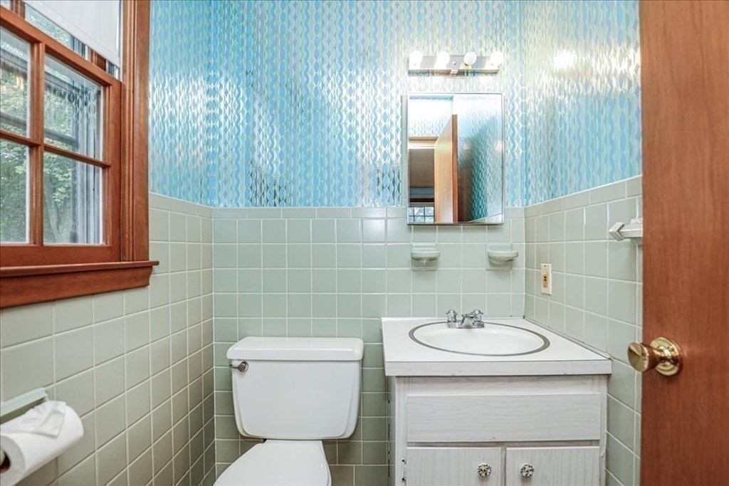 1 Donald Circle Andover, MA 01810 - Photo 16 of 42 a bathroom with a toilet sink and mirror
