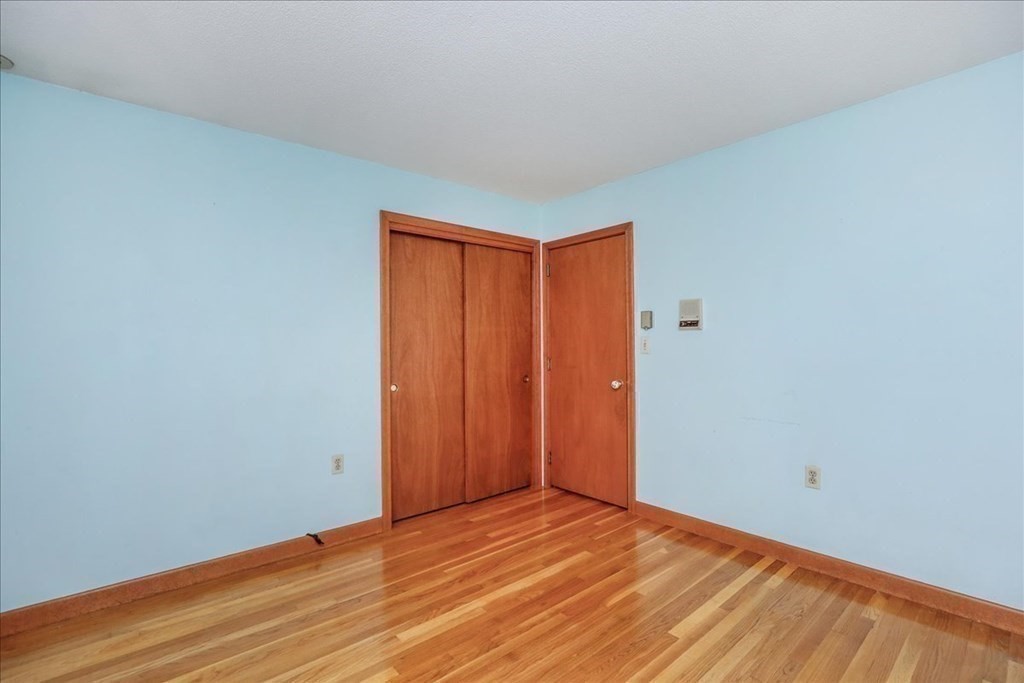 1 Donald Circle Andover, MA 01810 - Photo 19 of 42 a view of an empty room and wooden floor