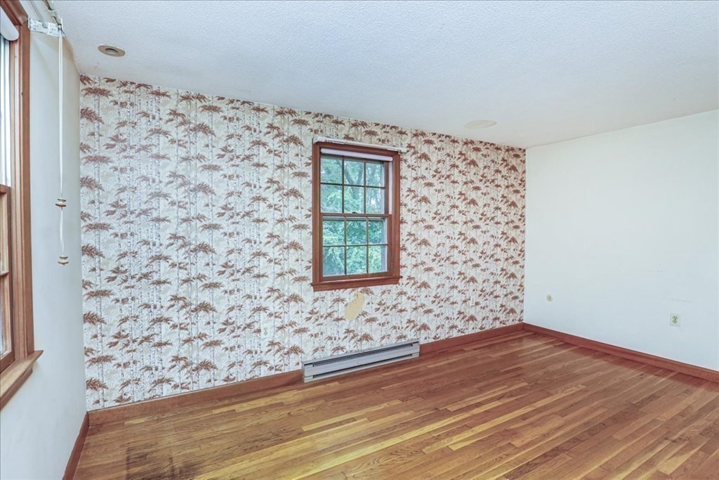 1 Donald Circle Andover, MA 01810 - Photo 21 of 42 a view of a livingroom with wooden floor and a window