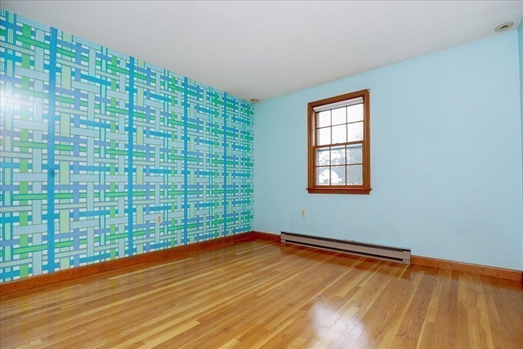 1 Donald Circle Andover, MA 01810 - Photo 23 of 42 a view of empty room with wooden floor and fan
