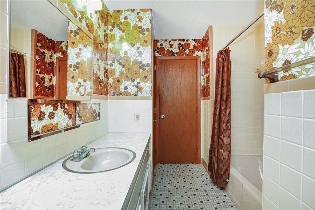 1 Donald Circle Andover, MA 01810 - Photo 25 of 42 a bathroom with a sink a toilet and shower curtain