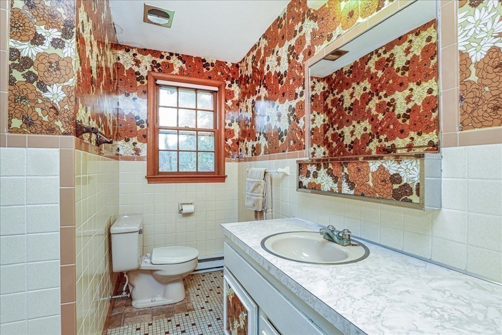 1 Donald Circle Andover, MA 01810 - Photo 26 of 42 a bathroom with a granite countertop sink and a mirror