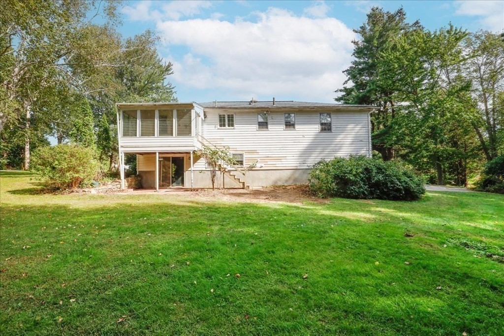 1 Donald Circle Andover, MA 01810 - Photo 30 of 42 a front view of a house with a yard