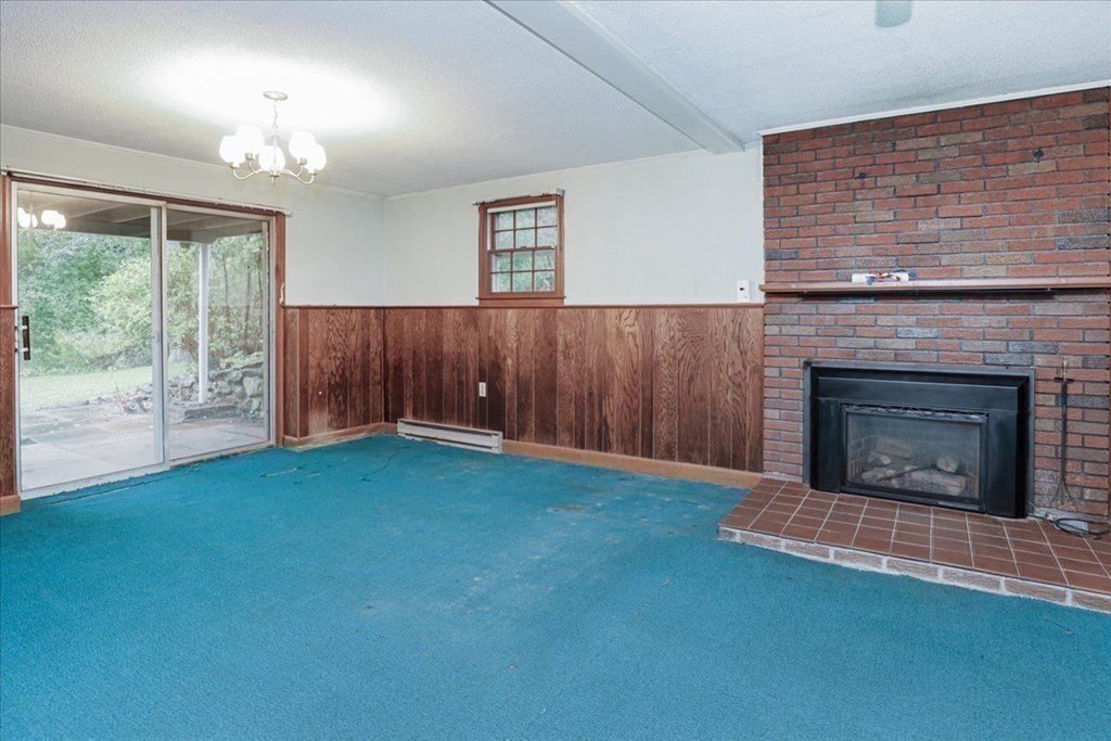 1 Donald Circle Andover, MA 01810 - Photo 33 of 42 a view of empty room with floor to ceiling window and fireplace