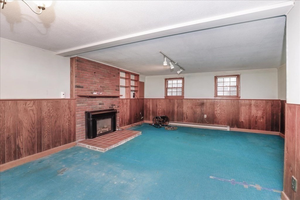 1 Donald Circle Andover, MA 01810 - Photo 35 of 42 a view of an empty room with a fireplace and a window