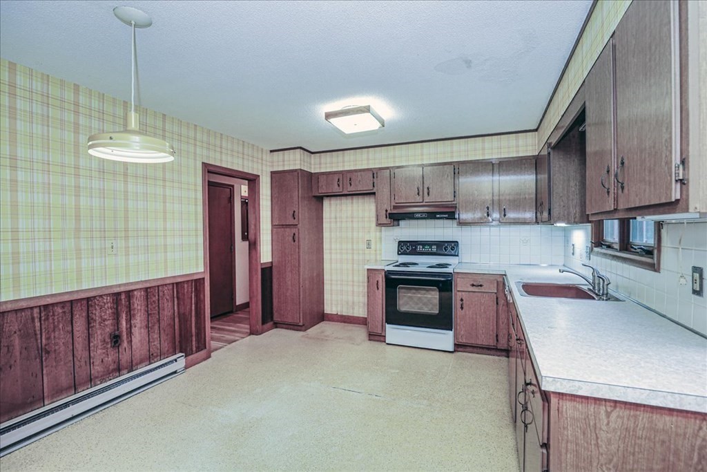 1 Donald Circle Andover, MA 01810 - Photo 9 of 42 a kitchen with stainless steel appliances granite countertop a refrigerator a sink dishwasher a stove and a wooden cabinets