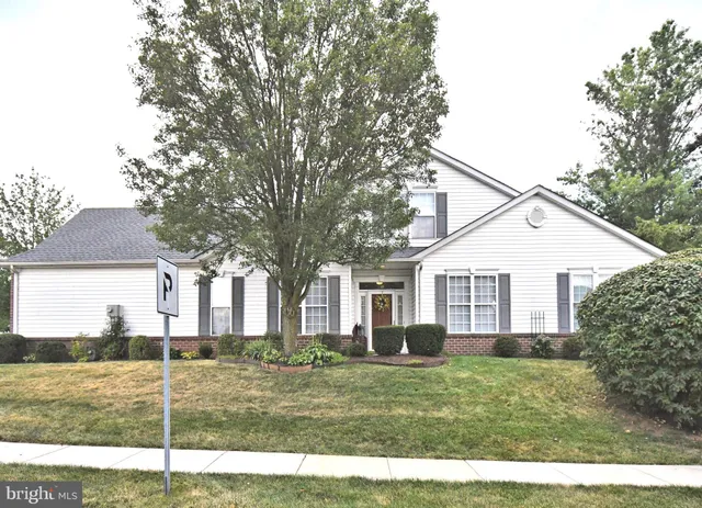 a view of a yard in front view of a house