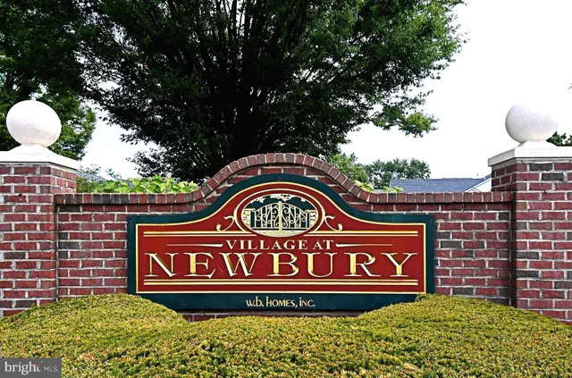 a sign that is on a brick wall