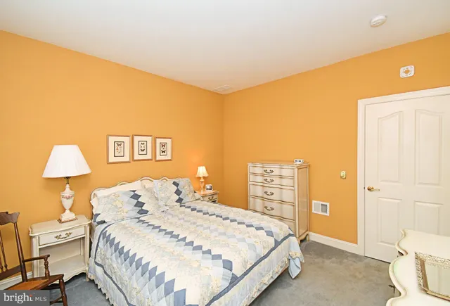 a bathroom with a sink a toilet and shower curtain