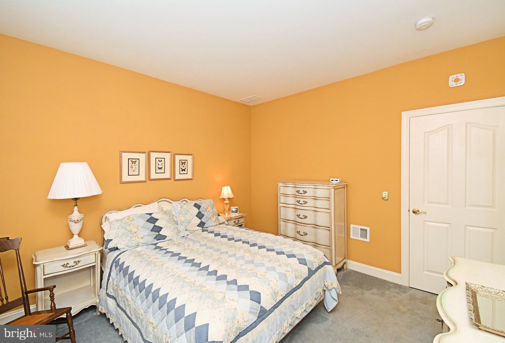 2 Newbury Way Lansdale, PA 19446 - Photo 22 of 29 a bedroom with a bed and a lamp