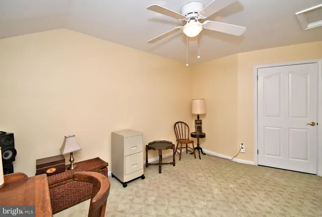 a backyard of a house with outdoor seating