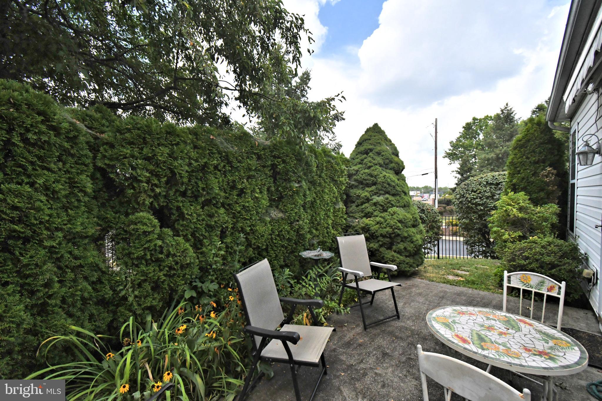 2 Newbury Way Lansdale, PA 19446 - Photo 29 of 29 a view of a patio with table and chairs and potted plants with sky view