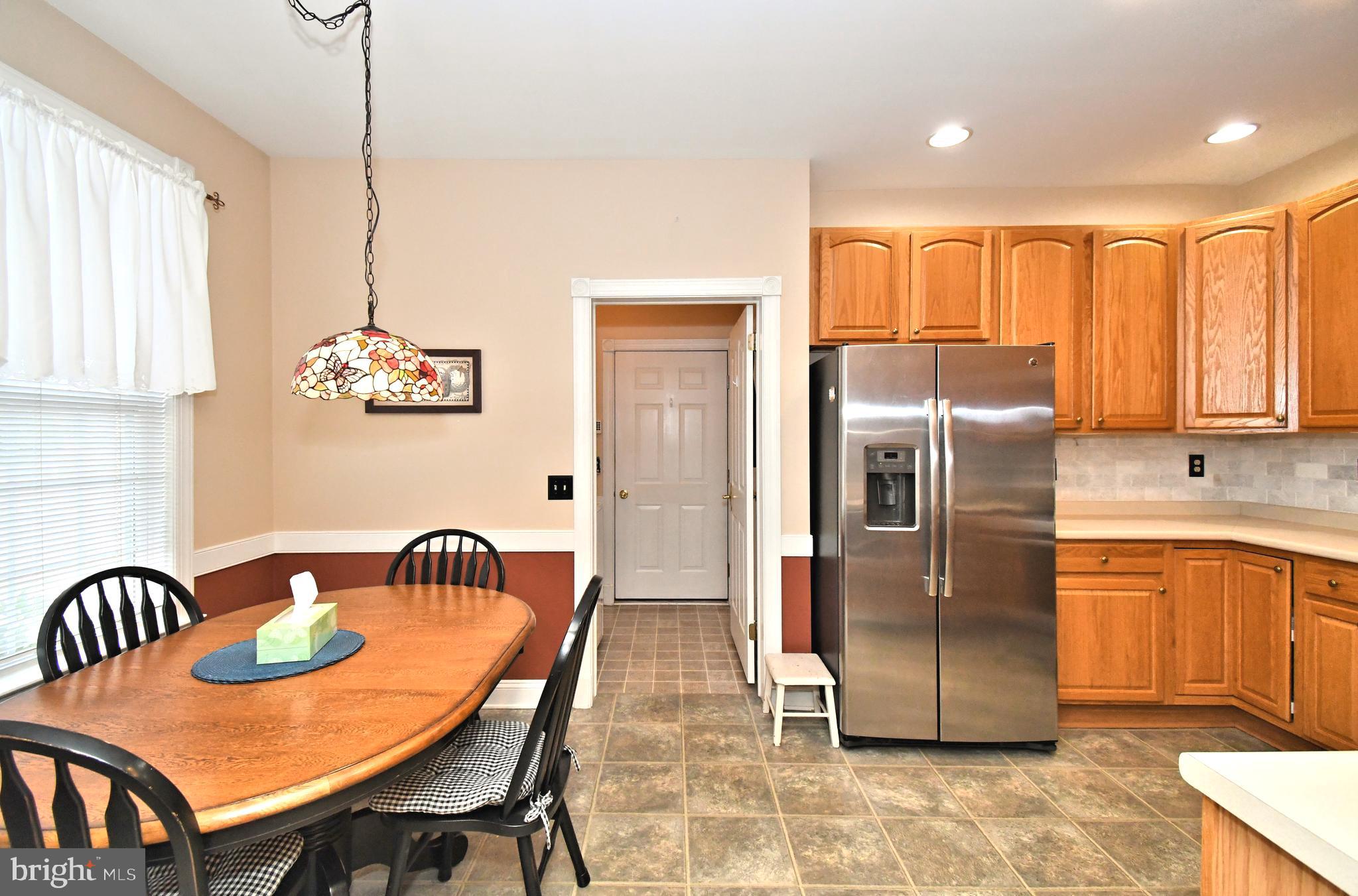 2 Newbury Way Lansdale, PA 19446 - Photo 9 of 29 a kitchen with stainless steel appliances granite countertop a refrigerator a sink a stove and island