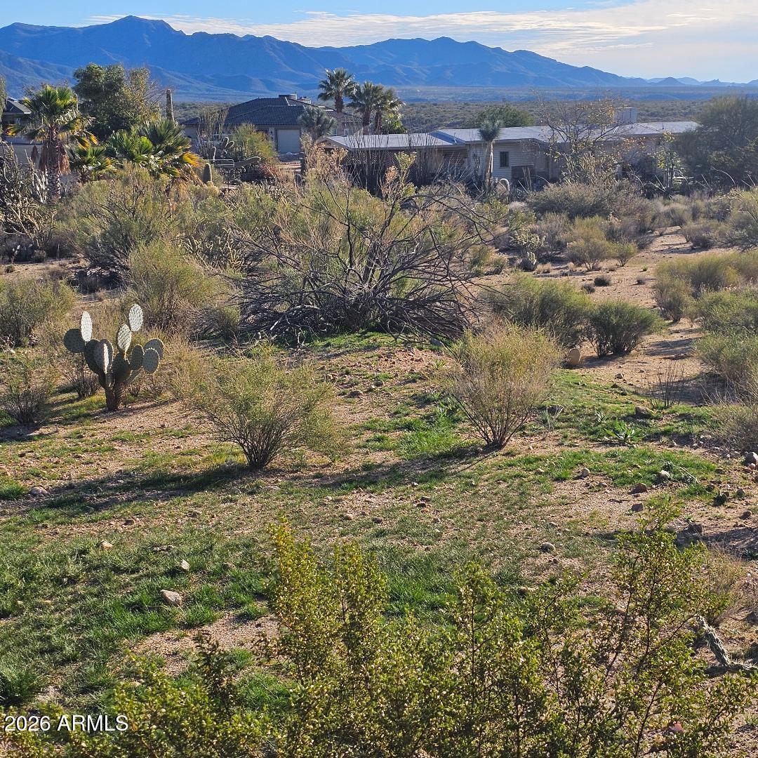 22290 Gayle Court, Unit 61 Congress, AZ 85332 - Photo 2 of 10 a view of a lake with mountains