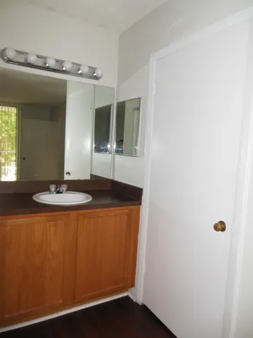 a bathroom with a sink and mirror